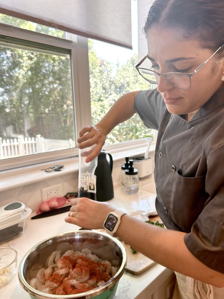 Chef Silmara Cavalcanti preparing a dish